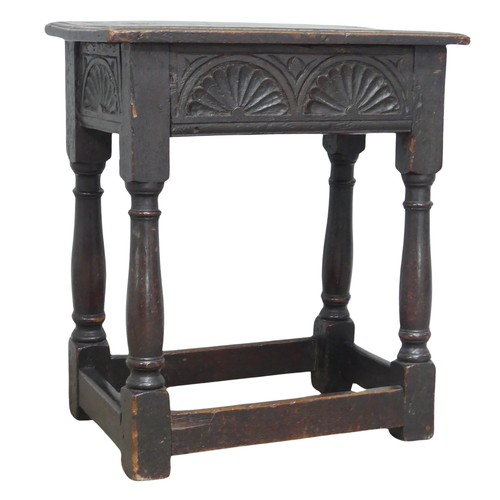 617 - An 18th century oak joint Stool, moulded rectangular top above carved frieze, raised on turned legs ... 