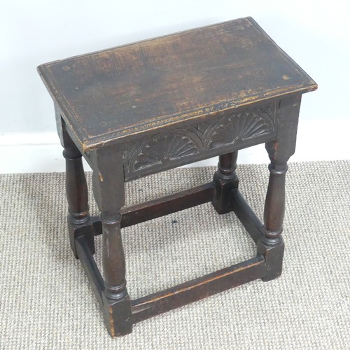 617 - An 18th century oak joint Stool, moulded rectangular top above carved frieze, raised on turned legs ... 