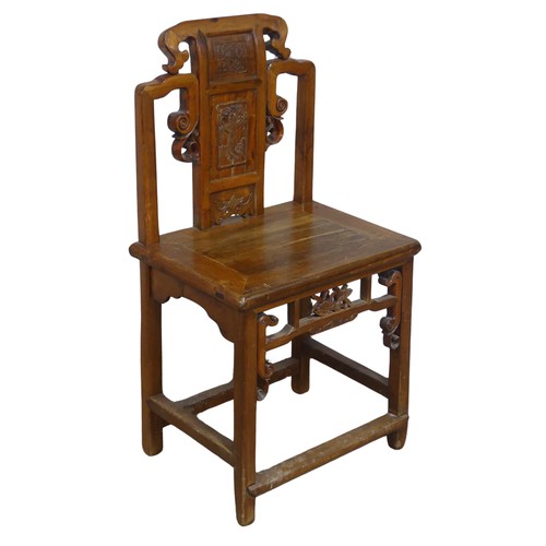 126 - A 20th century carved Chinese hall Chair, scrollwork back with centre panel carved with figure and f... 