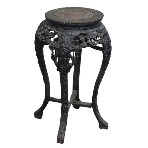 127 - A Chinese carved hardwood and pink marble circular Plant Stand, circa 1900, probably Padouk Wood, wi... 