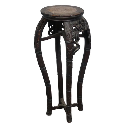 127 - A Chinese carved hardwood and pink marble circular Plant Stand, circa 1900, probably Padouk Wood, wi... 