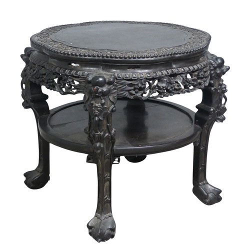 128 - A large Chinese carved hardwood centre / occasional Table, circa 1900, top with smooth flower centre... 