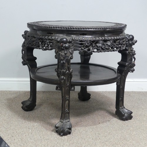 128 - A large Chinese carved hardwood centre / occasional Table, circa 1900, top with smooth flower centre... 