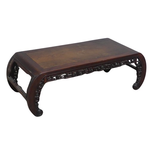 132 - A Chinese carved hardwood opium / coffee Table, top set with rectangular panel, above scrolled and p... 