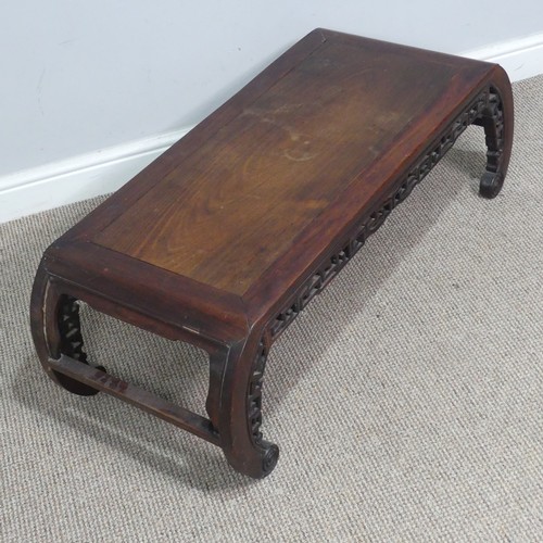 132 - A Chinese carved hardwood opium / coffee Table, top set with rectangular panel, above scrolled and p... 