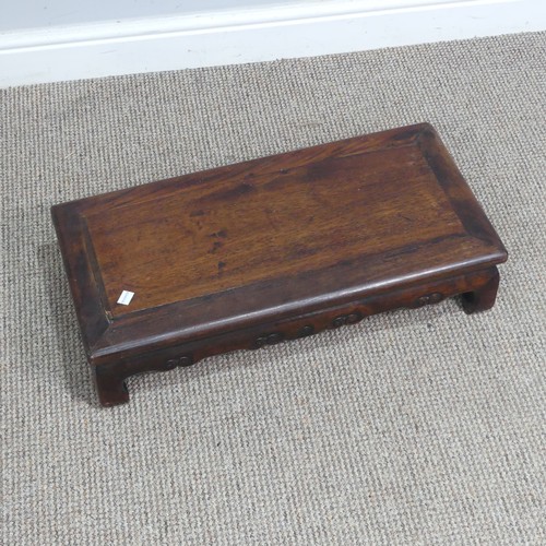 132 - A Chinese carved hardwood opium / coffee Table, top set with rectangular panel, above scrolled and p... 