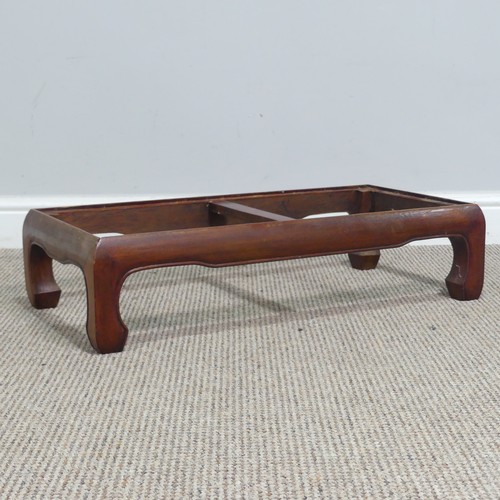 132 - A Chinese carved hardwood opium / coffee Table, top set with rectangular panel, above scrolled and p... 