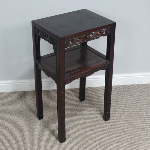 134 - An antique Chinese carved hardwood two tier Table / Plant Stand, rectangular top above carved and pi... 