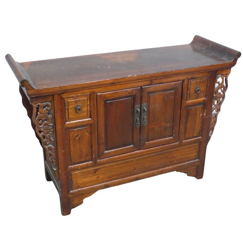 139 - A Chinese stained softwood altar Table, scrolled top above two cupboard doors flanked by small squar... 