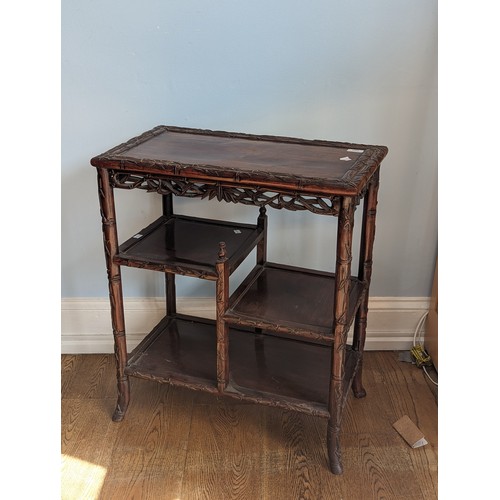 142 - An antique Chinese rosewood side Table, the rectangular top with carved bamboo style edges, tiered a... 