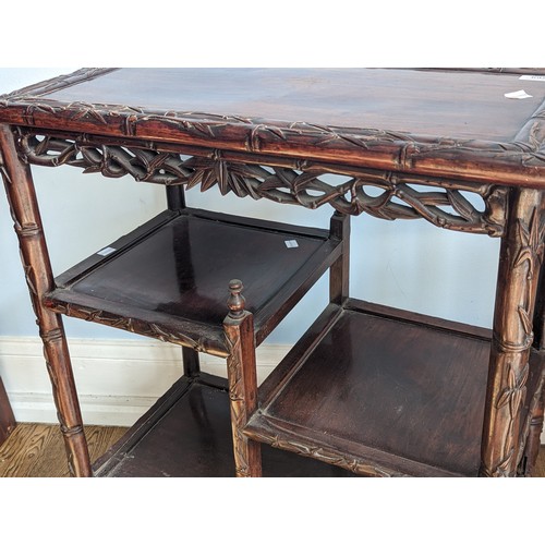 142 - An antique Chinese rosewood side Table, the rectangular top with carved bamboo style edges, tiered a... 