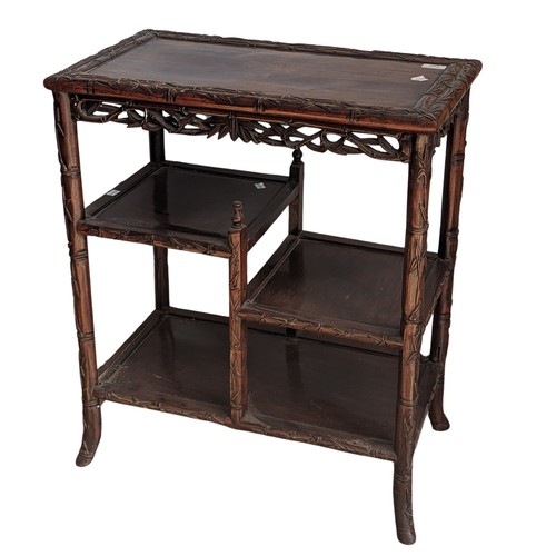 142 - An antique Chinese rosewood side Table, the rectangular top with carved bamboo style edges, tiered a... 