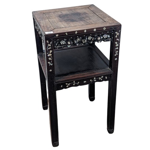 146 - An antique Chinese hardwood and mother of pearl inlaid two-tiered side Table, square top above carve... 