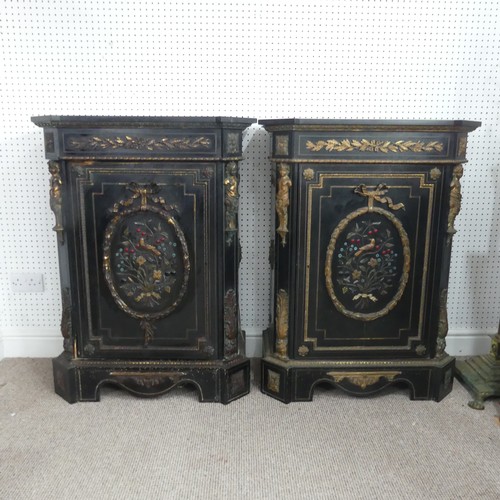 584 - A pair of Moroccan style black lacquered and gilt Cabinets, marbles tops above central gilt metal fo... 