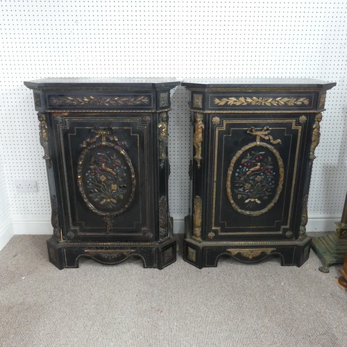 584 - A pair of Moroccan style black lacquered and gilt Cabinets, marbles tops above central gilt metal fo... 