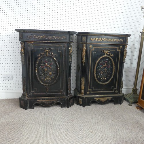 584 - A pair of Moroccan style black lacquered and gilt Cabinets, marbles tops above central gilt metal fo... 