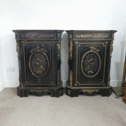 584 - A pair of Moroccan style black lacquered and gilt Cabinets, marbles tops above central gilt metal fo... 