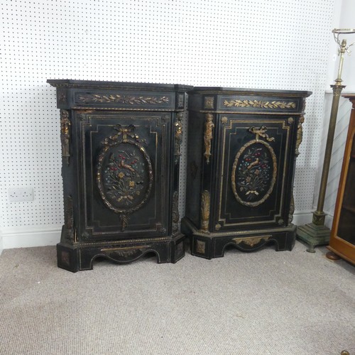 584 - A pair of Moroccan style black lacquered and gilt Cabinets, marbles tops above central gilt metal fo... 