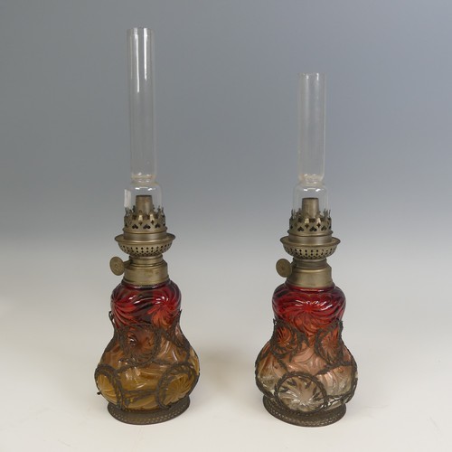 709 - A pair of unusual Wild & Wessel cranberry glass oil Lamps, Berlin, marked 'W & W / Kosmos', ... 