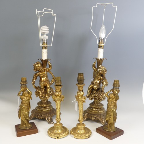 534 - A pair of 20th century gilt brass Cherub table Lamps, raised on scroll and pierced bases, H 66 cm, t... 