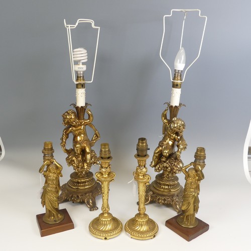 534 - A pair of 20th century gilt brass Cherub table Lamps, raised on scroll and pierced bases, H 66 cm, t... 