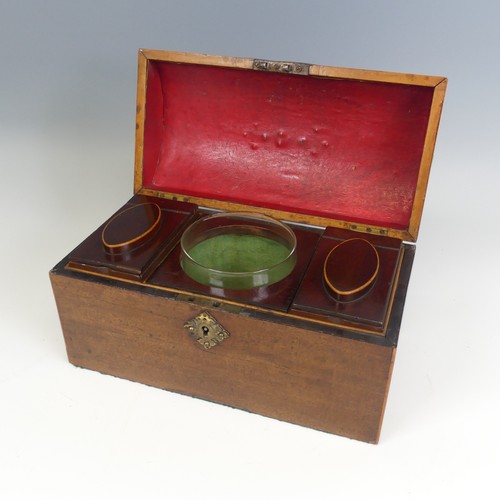 493 - An early 19th century mahogany dome topped Tea Caddy, hinged top enclosing mixing bowl and two lift-... 