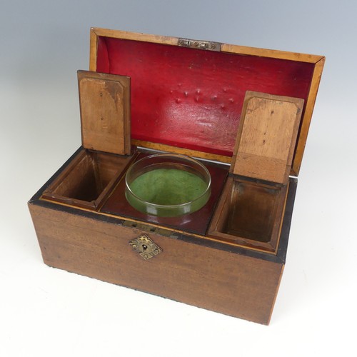 493 - An early 19th century mahogany dome topped Tea Caddy, hinged top enclosing mixing bowl and two lift-... 