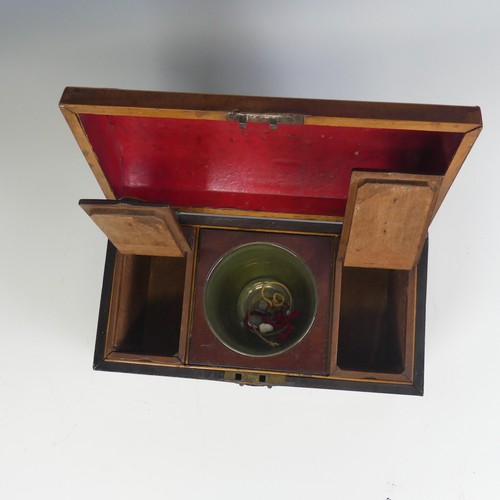 493 - An early 19th century mahogany dome topped Tea Caddy, hinged top enclosing mixing bowl and two lift-... 