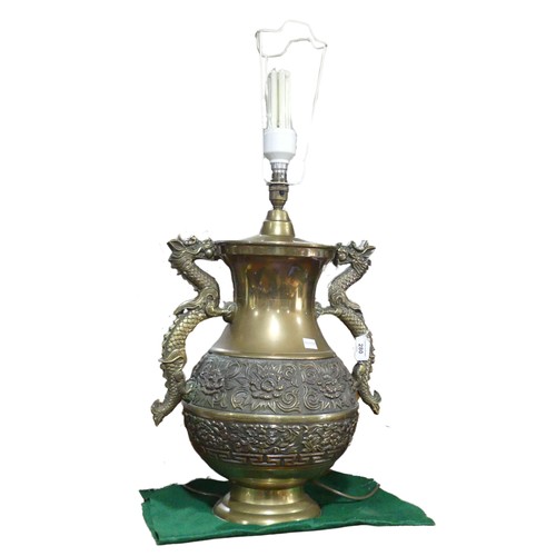 206 - A Chinese style brass twin handled table Lamp, handles in the shapes of dragons, H 75 cm.... 