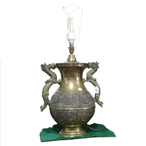 206 - A Chinese style brass twin handled table Lamp, handles in the shapes of dragons, H 75 cm.... 