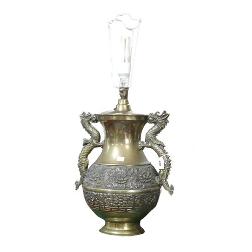 206 - A Chinese style brass twin handled table Lamp, handles in the shapes of dragons, H 75 cm.... 