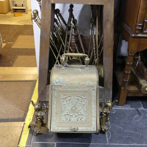 690 - An antique brass coal Scuttle, together with a pair of antique brass firedogs in the form of winged ... 