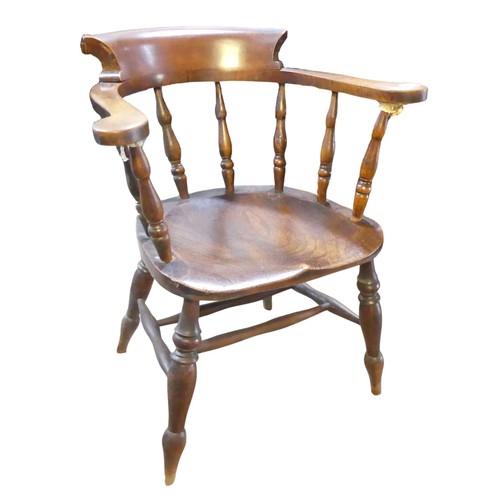 595 - A 19th century elm and ash smokers bow / captains Chair, horseshoe bar back above scroll arms and sh... 