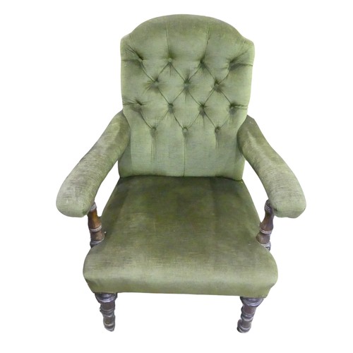 655 - A Victorian upholstered button back open Armchair, raised on turned front legs and splayed rear legs... 