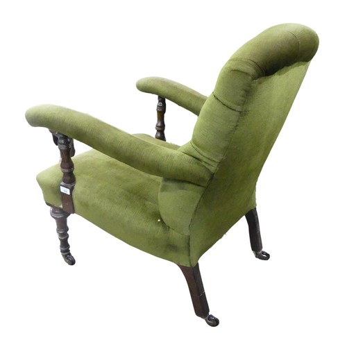 655 - A Victorian upholstered button back open Armchair, raised on turned front legs and splayed rear legs... 