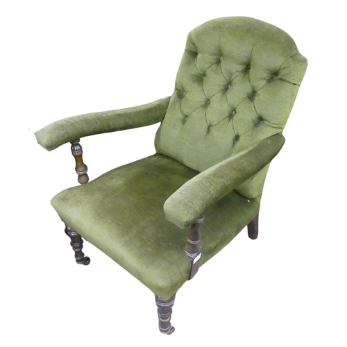 655 - A Victorian upholstered button back open Armchair, raised on turned front legs and splayed rear legs... 