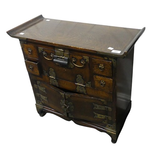 200 - A 20th century Korean elm side Cabinet, with curved top and brass mounts, W 71 cm x H 64 cm x D 30.5... 