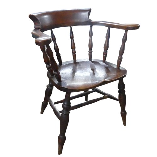 568 - A 19th century elm and ash smokers bow / captains Chair, horseshoe bar back above scroll arms and sh... 