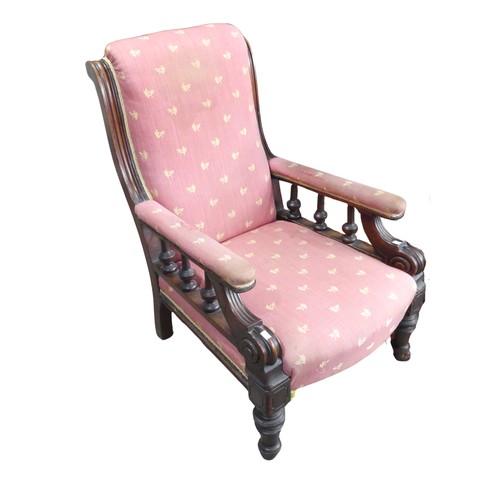 676 - A Victorian mahogany Armchair, with turned spindle gallery arms, raised on turned supports and casto... 