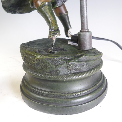 682 - A reproduction bronzed resin Lamp, with damages see images, H 60 cm.