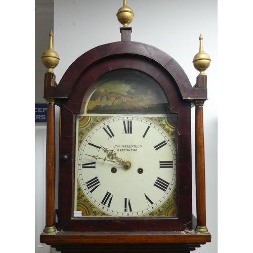 382 - A 19th century northern mahogany Longcase Clock, the arched hood above a glazed door flanked by turn... 