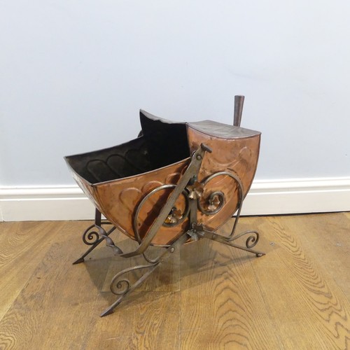 499 - An Arts and Crafts copper Coal Scuttle, in the manner of Christopher Dresser, with swing handle and ... 