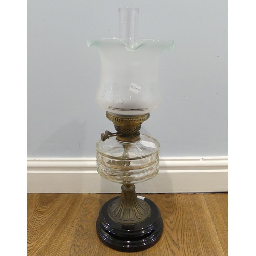 528 - An antique clear glass and brass Oil Lamp, stamped 'English Made', with fluted frosted and etched gl... 