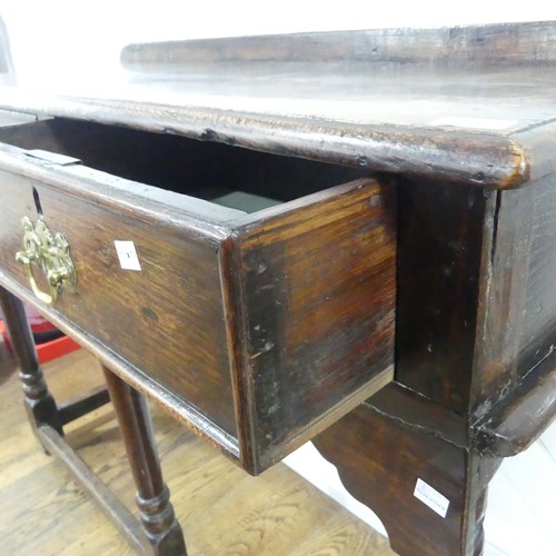 696 - An 18th century oak hall Table, moulded top with rail back, above two frieze drawers, raised on five... 