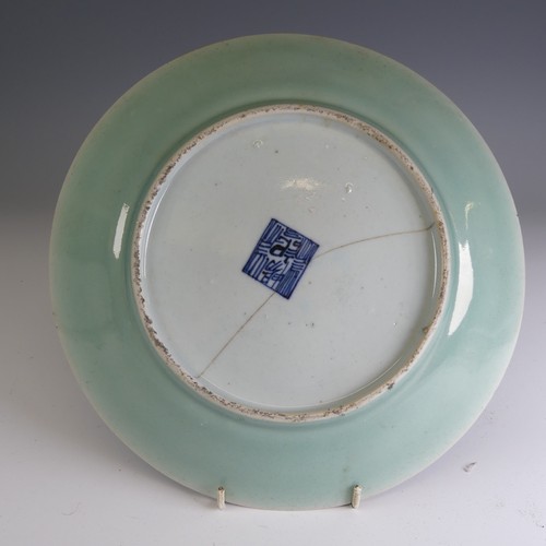 4 - A matched pair of 19thC Chinese celadon Chargers, typical colouration with central depiction of orna... 