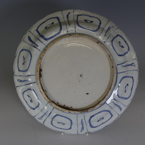 1 - A 17thC Chinese blue and white kraak type porcelain Plate, decorated to the well with flower basket,... 