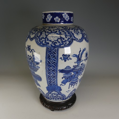 18 - A large 18thC Chinese porcelain blue and white Ginger Jar, the body decorated with four alternating ... 