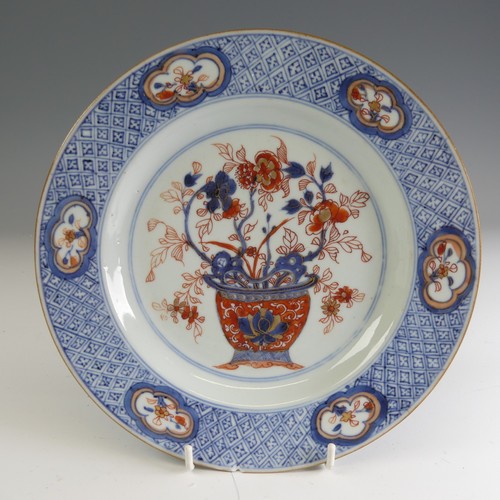 20 - A pair of 18thC Chinese rose imari porcelain Plates, decorated to the well with flower basket and en... 