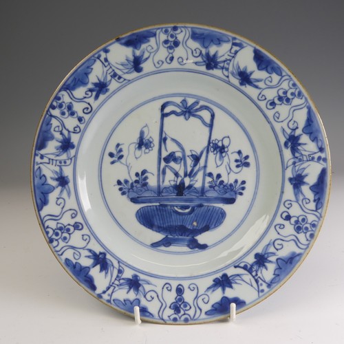 21 - A near pair of 18thC Chinese blue and white porcelain Chargers, each decorated centrally with floral... 