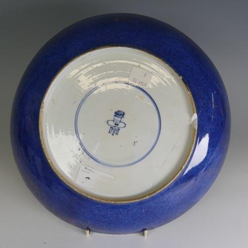 34 - An 18thC Chinese porcelain powder blue Charger, decorated with overpainted gilt depiction of ornate ... 